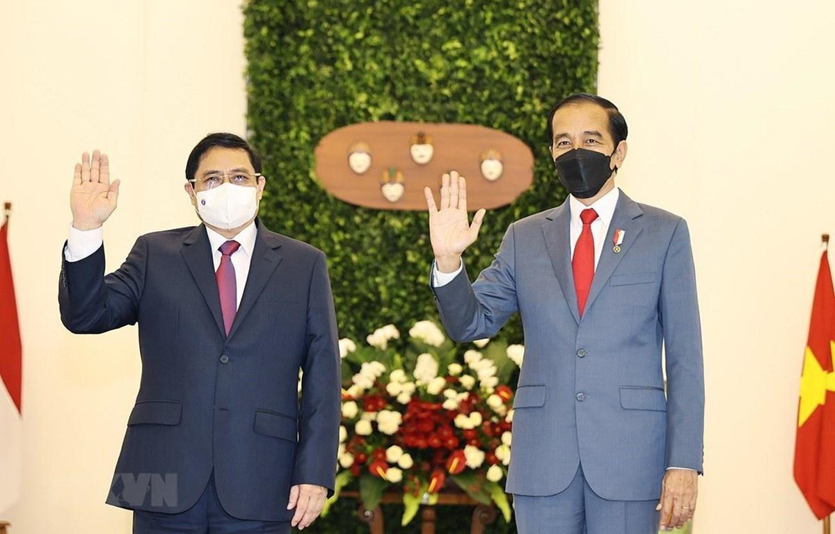 Việt Nam củng cố và mở rộng quan hệ Đối tác chiến lược với Indonesia Thủ tướng Phạm Minh Chính và Tổng thống Indonesia Joko Widodo. (Ảnh: Dương Giang/TTXVN)